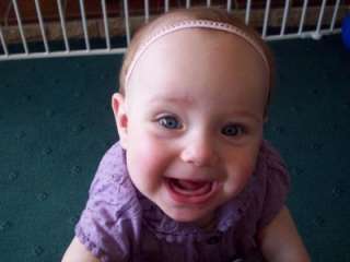 Below Baby Isabella aged One year wearing her Pink Crown Clips bought 