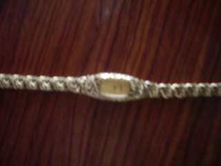 WATCH 14 K YELLOW GOLD 1 TIME USED BEAUTIFUL WATCH WITH CUT OF 