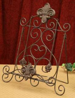 Made of Metal and Resin with chain page weights, this fleur de lis 