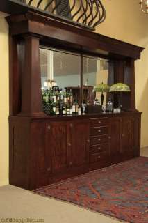 This Arts and Crafts or Mission Oak solid oak back bar has simple 