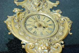 ORNATE FIGURAL EMBOSSED BRASS WAG ON THE WALL CLOCK  