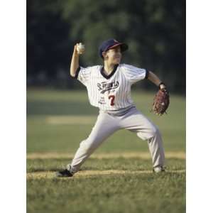  Young Boy Pitching During a Little League Baseball Games 