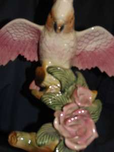   Maddux Pink Cockatoo Bird with open wings on a tree trunk & pink roses