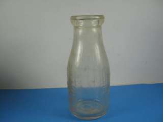 Glass milk bottle marked Bordens Farm Products Co. IL  