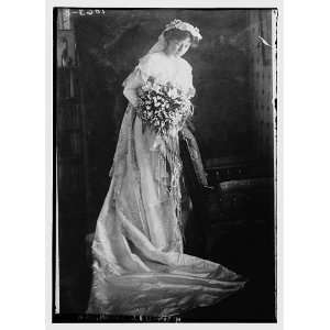  Mrs. Harold J. Ellsworth holding bouquet