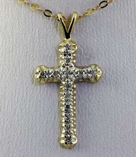   diamond and 14k yellow gold cross pendant measuring 1 inch long