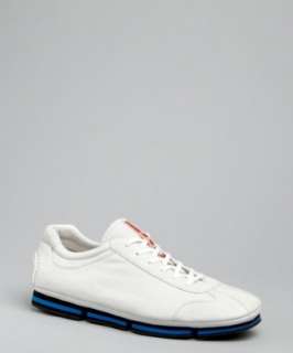 Prada Prada Sport white leather lace up and blue stripe sole sneakers 